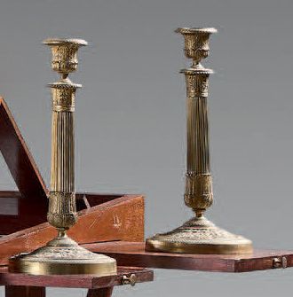 A pair of ormolu torches decorated with acanthus...
