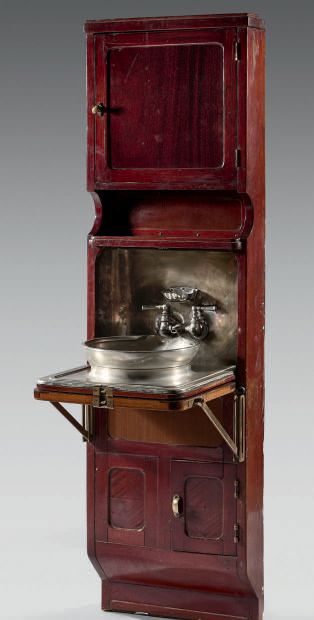 Mahogany washbasin cabinet, with a door at...