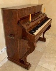 Mahogany and mahogany veneer piano, the flap...