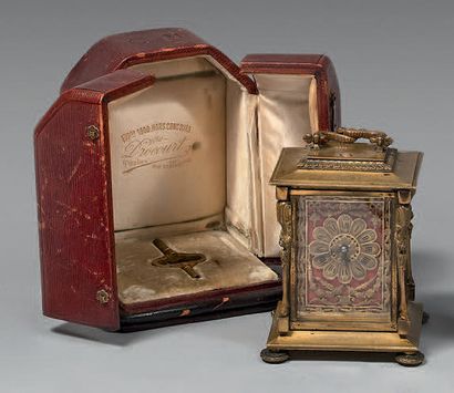 An ormolu cage clock, with two intertwined...