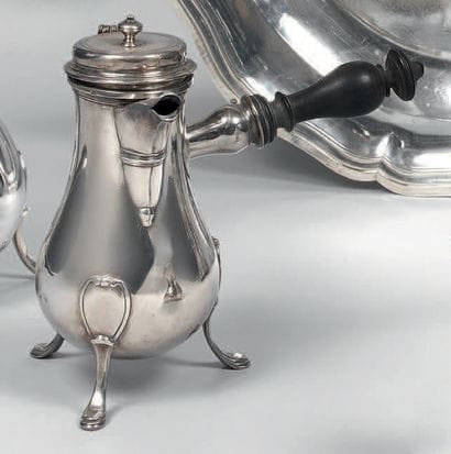 Silver tripod coffee pot, of baluster shape,...