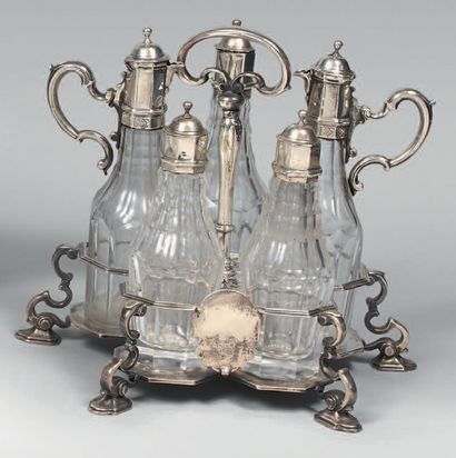 A silver and cut crystal condiment set, standing...