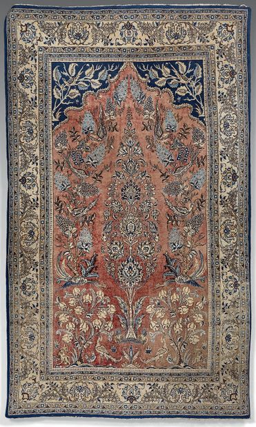 Persian wool carpet, decorated with a flowering...