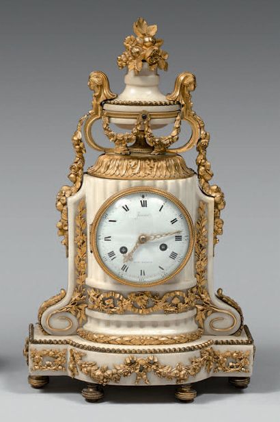 White marble and gilt bronze clock. The dial...