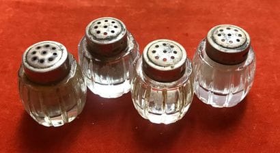 Four barrel-shaped crystal saltshakers, cut...
