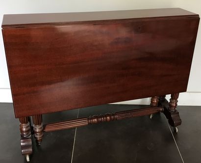 Mahogany English table with two leaves. The...