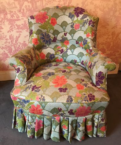 Comfortable armchair upholstered in a floral...