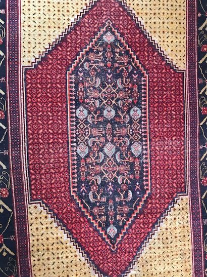 Oriental wool carpet. Decorated in the center...