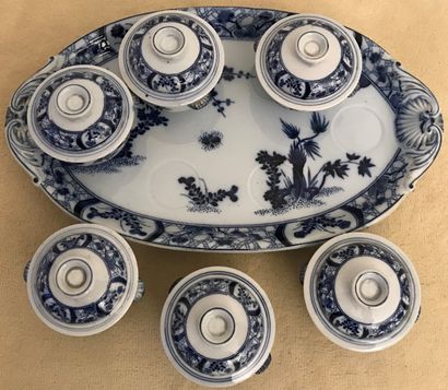 Suite of six cream pots and their lids on...