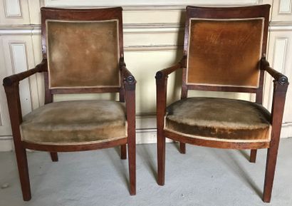 Pair of armchairs in moulded fruitwood. The...