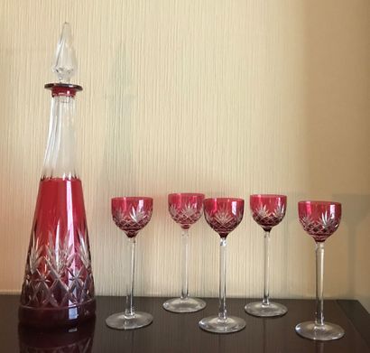 A red lined crystal decanter and five liqueur...