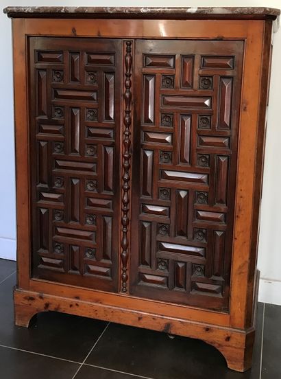 Small low cabinet in fruitwood, the uprights...