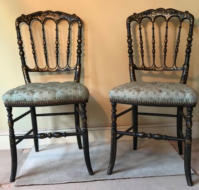 Pair of blackened wood chairs decorated with...