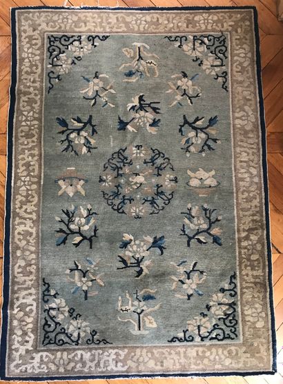 Chinese wool carpet decorated with a central...