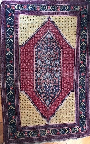 Oriental wool carpet. Decorated in the center...