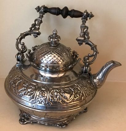 Metal teapot decorated with cartouches and...