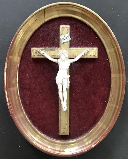 Christ in ivory on a cross and in a gilded...
