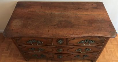 Moulded fruitwood chest of drawers, the slightly...