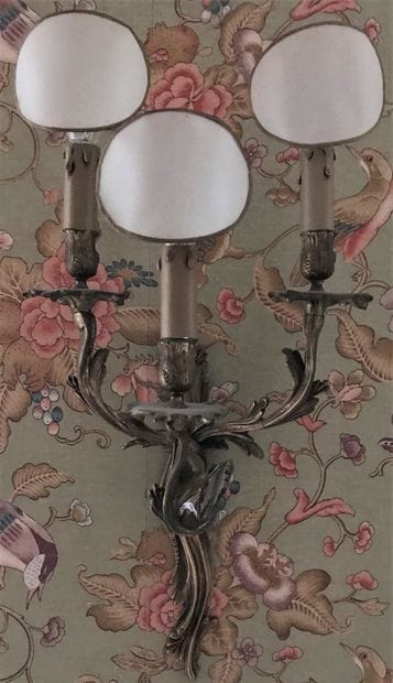 A pair of ormolu wall sconces, the three...