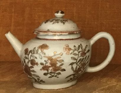 Small porcelain teapot with floral decoration...