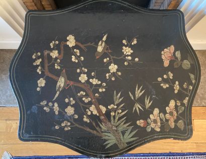 Coffee table, the poly-lobed lacquer top...