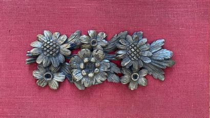 Decorative element in carved wood representing...