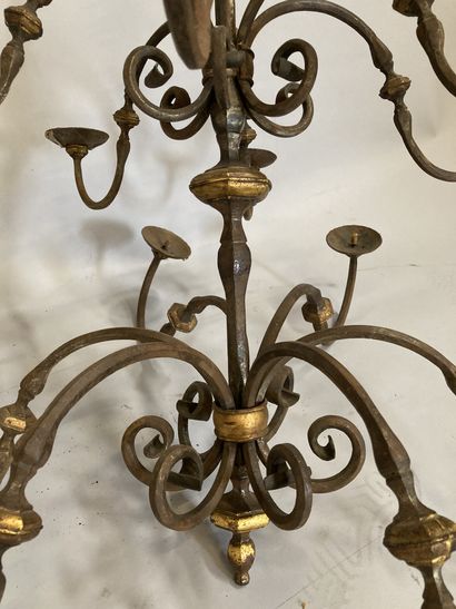 A wrought iron chandelier with twelve arms...