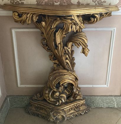 A gilded wood console, the top decorated...