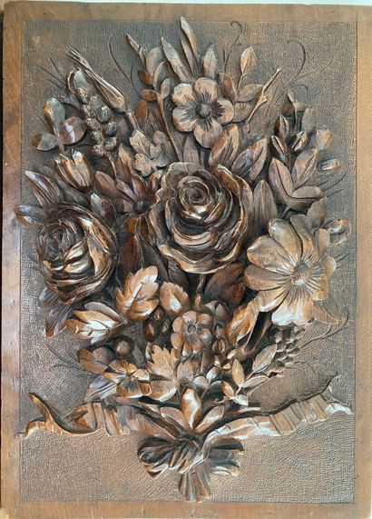 Decorative wood panel carved with a bouquet...