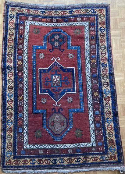 Oriental wool carpet with stylized decoration...