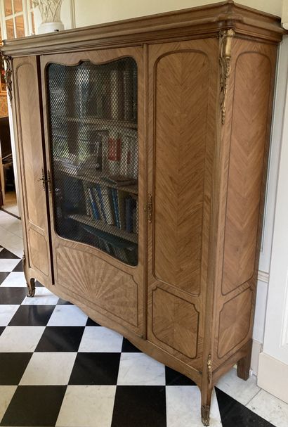Mahogany and veneer bookcase. The corners...