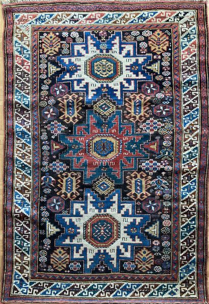 Oriental wool carpet decorated with a star...