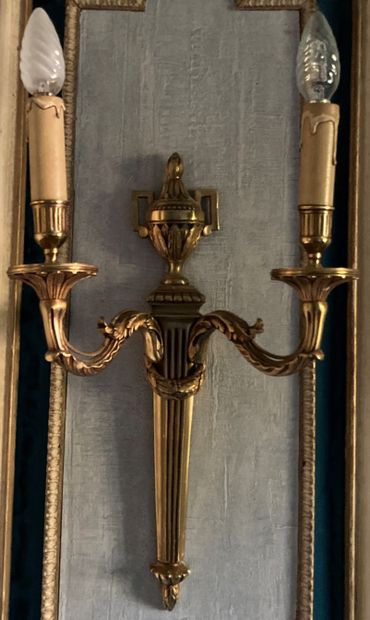 A pair of cast bronze wall sconces, the fluted...