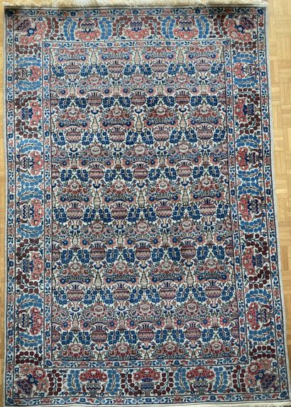 Persian wool carpet decorated with flowering...