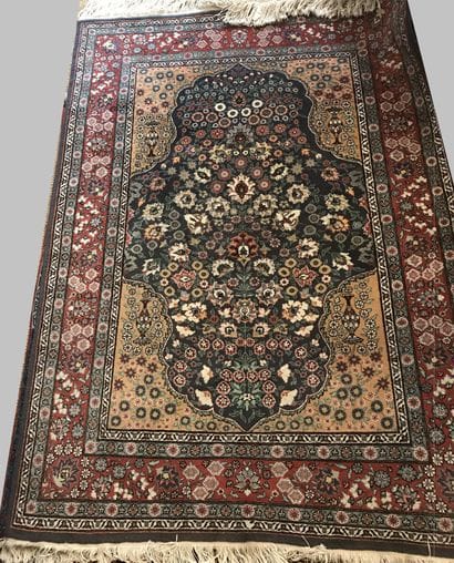 Oriental wool carpet with stylized decoration...