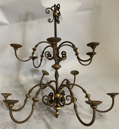 A wrought iron chandelier with twelve arms...
