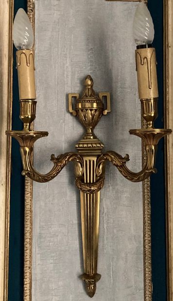 A pair of cast bronze wall sconces, the fluted...
