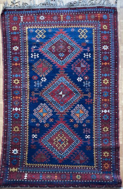 Oriental wool carpet decorated with three...