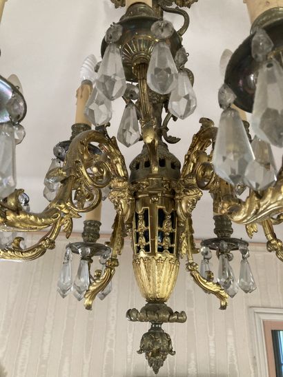 A cast bronze chandelier with nine lights...
