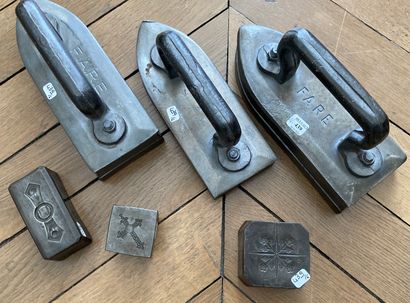 Three old cast iron irons. 

Three printing...