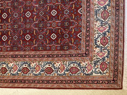 Large woolen rug with stylized flowers on...