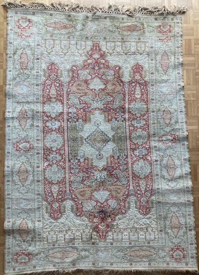 Oriental wool carpet, decorated with a large...