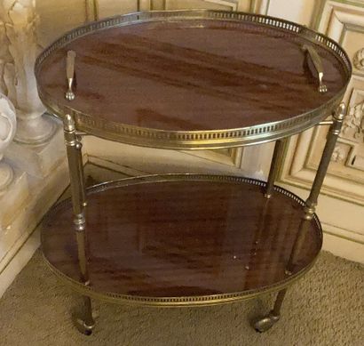Mahogany and gilded brass oval waiter's table....
