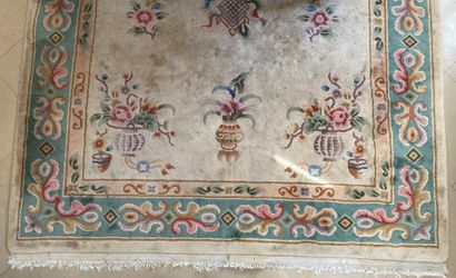 China carpet decorated with flowers and vases...