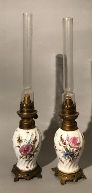 Pair of small porcelain oil lamps, with twisted...