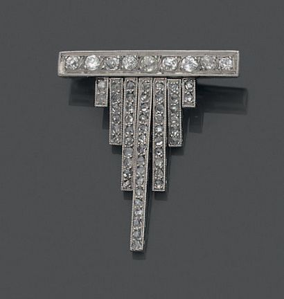 Platinum brooch set with a line of nine old-cut...