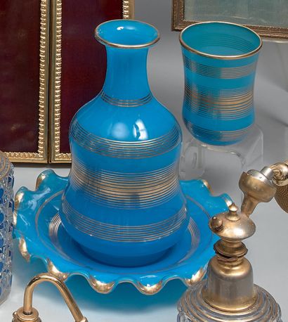 A blue opaline water glass, with gilding...