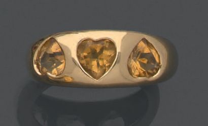 An 18K (750) yellow gold half-shell ring...