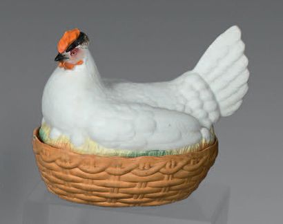 A large polychrome biscuit egg dish with...