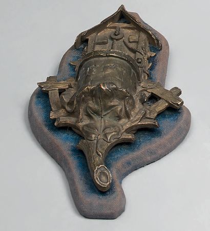Patinated bronze match holder, showing a...